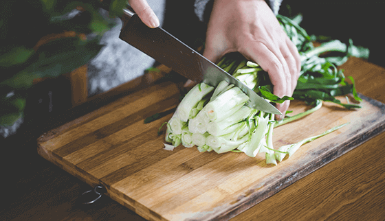 hands cutting veggies